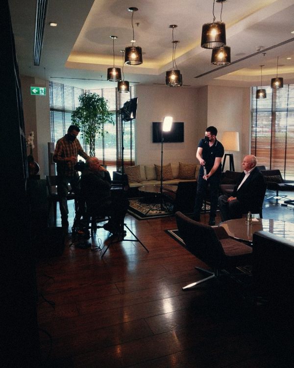 Interview being lit and filmed in a lounge